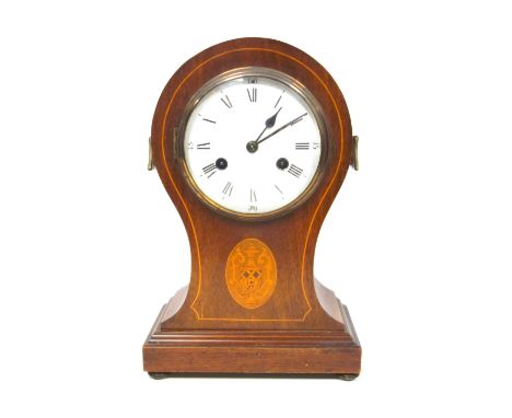 Edwardian mantel clock with a white enamelled circular dial, black Roman numerals enclosing an 8-day striking movement, in an