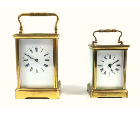 An early 20th century brass carriage clock, the full length enamel dial inscribed Joseph Penlington, Paris, to a twin barrel 
