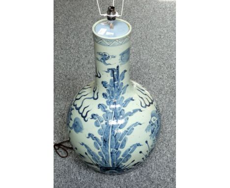 A Large 20th century Chinese blue and white vase converted to a lamp and drilled for electricity, depicting mythical beasts a