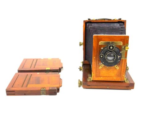 A 19th century Ashford?s Patent, mahogany cased folding field camera, together with two plate holders 