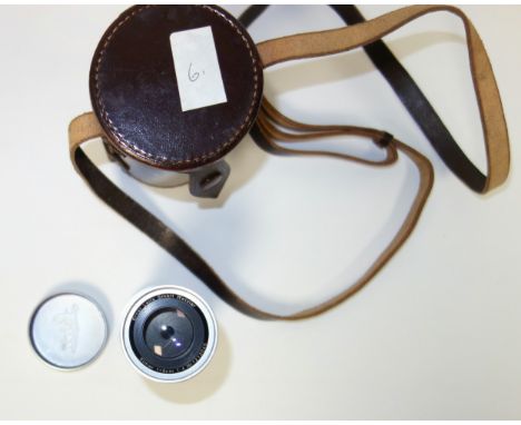 An Ernest Leitz Wetzlar Leica lens, Elmar f-9cm in brown leather carrying case, and a Leitz Leica  Tele Elmar lens serial No.