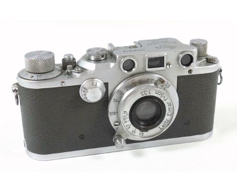 An Ernest Leitz Wetzlar Leica IIIb camera stamped Luftwaffen?Eigentum, serial No362916, with Leitz f=5 cm lens, red blind, in