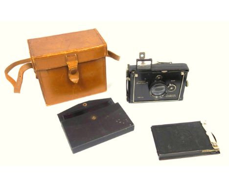 A Plaubel Makina folding camera with accessories, cased 