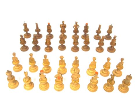 Swiss light and dark carved wood chess set, mostly in the form of figures, of 32 pieces, height of king, 7 cm (some a/f) and 