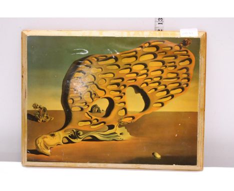A Salvador Dali print on board 