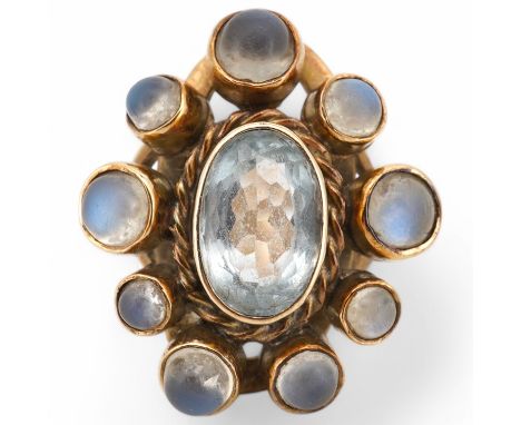 A yellow metal single stone aquamarine and nine stone cabochon moonstone set oval cluster ring, size R, gross weight 7.8grams