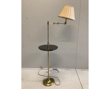 A telescopic standard lamp with a lacquered shelf, height 152cm. Condition - fair