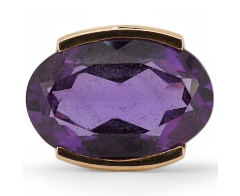 An 18k and single stone oval cut synthetic colour change corundum set dress ring, size P, gross weight 10.6 grams. Condition 