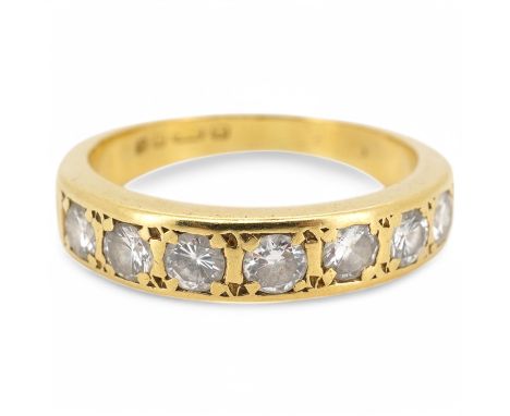 A modern 18ct gold and seven stone diamond set half hoop ring, size M, gross weight 4 grams.
