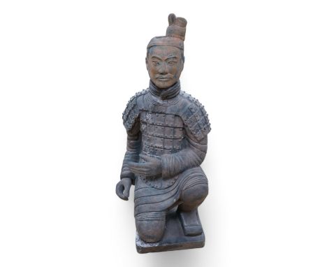 A large Chinese pottery figure of a kneeling warrior/soldier, 53cm high. Condition - good