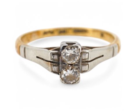 An Art Deco 18ct, plat and two stone diamond set ring, size K, gross weight 2.5 grams. Condition - fair to good