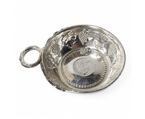A George V silver taste vin, by Daniel &amp; John Welby, with fruiting vine decoration and inset coin centre, London, 1924, d