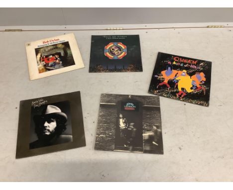 A collection of LP record albums; artists include Diana Ross, Bryan Ferry, George Harrison, Bob Dylan, Elton John, Cat Steven