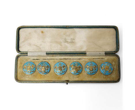 A George V set of 6 blue enamelled silver gilt buttons with armorial and motto 'cumnia subjescisti subpedieue oves et loves',