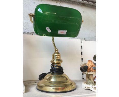 A desk lamp with green glass shade 