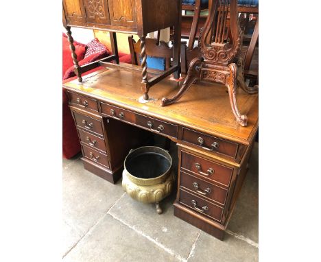 A reproduction tooled top pedestal desk. 