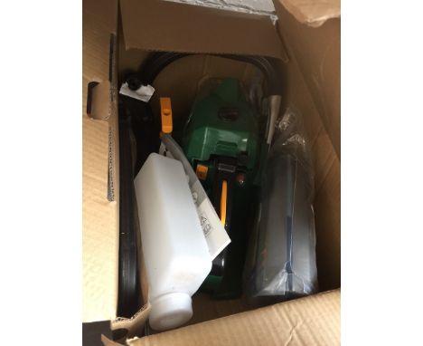 An Oregon petrol chainsaw with oil 