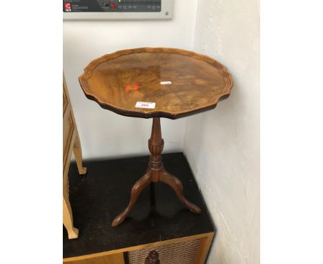 A reproduction figured walnut tripod wine table. 