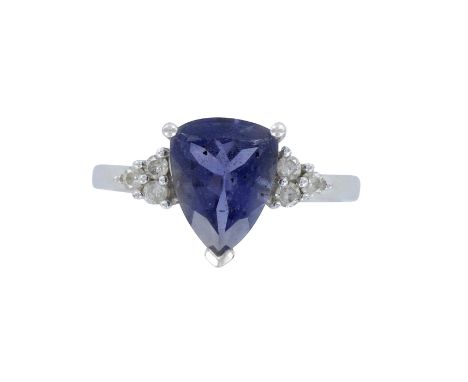 An elegant ladies cocktail ring with a pear shaped amethyst and 6pc round cut diamonds. Marked 14K and LGL trademark. Size 7.