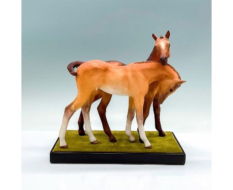 An beautiful hand painted sculpture of two caramel-color horses. Cybis marks on the underside of the horses. This item has a 