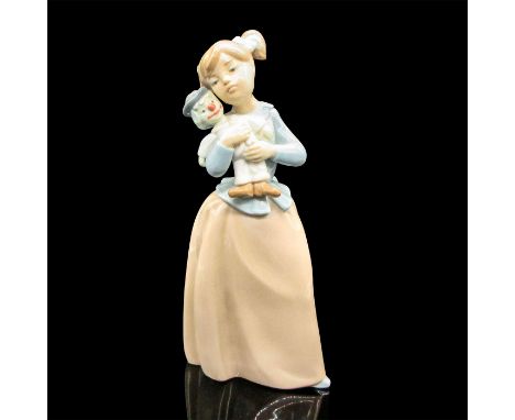 Holding doll is colored in soft tan and blues. Glossy finish. Nao by Lladro backstamp. 1808. Issued: c.1985Dimensions: 4"L x 