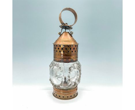 Charming wall mounted carriage lamp with brass support ring mounted lantern, star shaped pieced sides, and a pressed bubble g