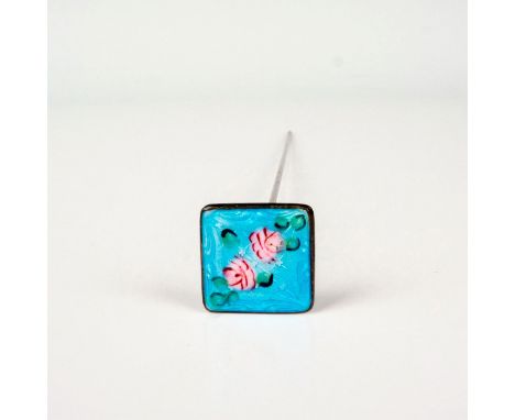 Features two flower designs set against a soft blue enamel ground, mounted on a metal shank. Dimensions: 7.75"L x 0.75"WCondi