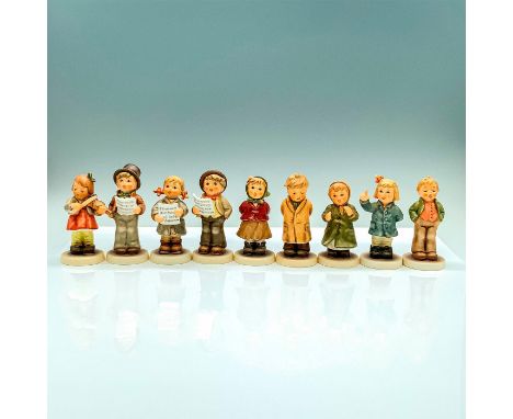 A set of 9 figurines that depict multiple children each participating in part of a song performance, from singers, to musicia
