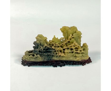 Intricate design of trees and mountains. Darker colored base with lighter colored tree design. Dimensions: 6.5"L x 2"W x 4"HC