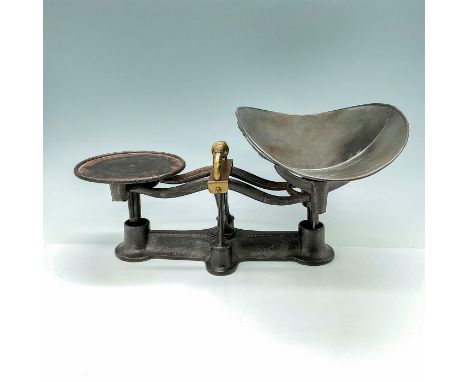 Charming cast iron balance scale with filigreed brass handle. Issued: 20th CenturyDimensions: 11.5"L x 4.75"W x 5.25"HConditi