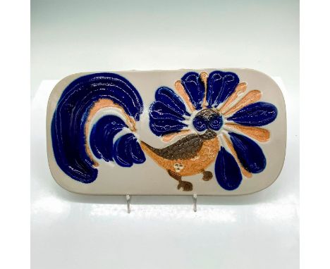 Ceramic tile glazed with cobalt, orange, and grey. Decorated with a sunken bird relief. Stamped '*1563' on back. Dimensions: 