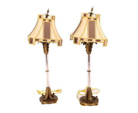 A set of 2 beautiful tall slender lamps with matching lamp shades. Glass columns and brass molded acanthus leaves. Decorative