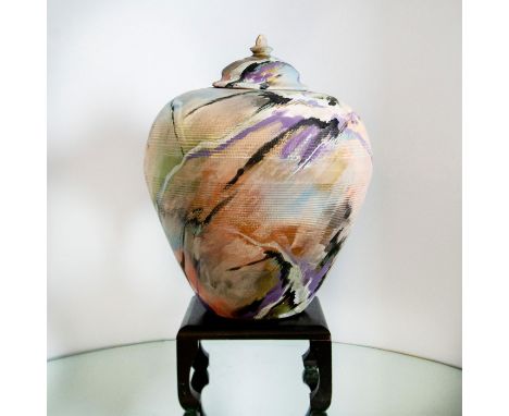 Unique hand-thrown pottery vessel with lid and a base by Victor Rios. This stunning unglazed piece is colored with shades of 