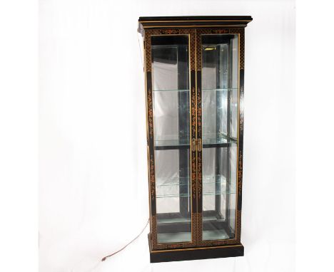 A beautiful wooden case with red and gilded flowers. A back mirror, lighting fixture on the bottom, and adjustable 3 glass sh