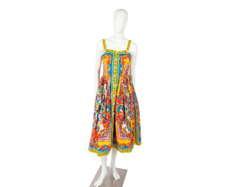 A stunning sleeveless women's dress in beautiful hues, with folklore-inspired chromatic design. This gown is completed with e
