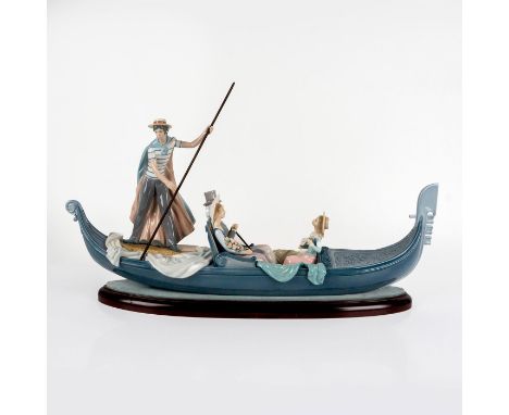 Glazed figural depicting gondola ride with married couple being serenaded. All colored in soft greys, rose and blues. Lladro 