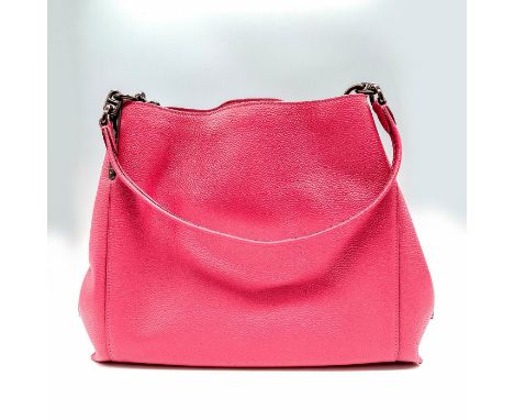 Polished pebble leather. Inside zip and multifunction pockets. Center zip compartment. Snap closure with fabric lining. Coach