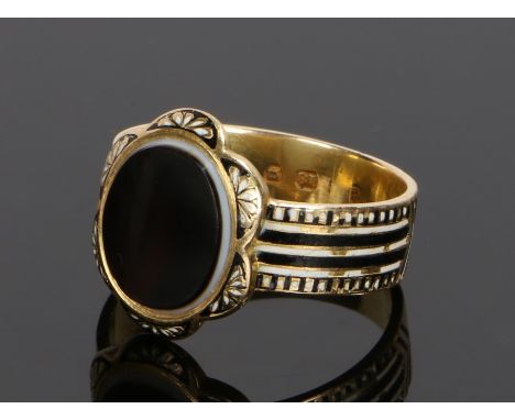 Victorian mourning ring, assayed for London 1871, with a banded agate head with white and black enamel shoulders, the inscrip