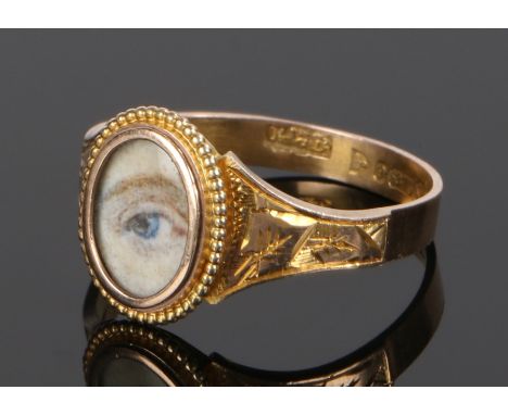 9 carat gold "eye" ring, the painted head with a blue eye set to 9 carat gold, ring size T