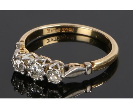 18 carat gold diamond set ring, set with three diamonds to the head, ring size M