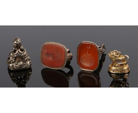 Collection of four seals, to include an example with a lion, an axe above a monogram seal, Courage above TW and a plain examp