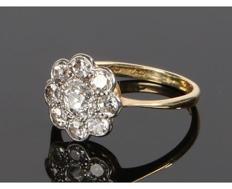 18 carat gold diamond set cluster ring, with a central diamond and diamond surround, ring size K