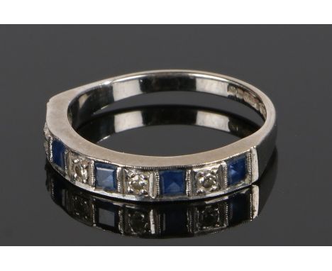18 carat white gold sapphire and diamond set half eternity ring, the head set with five square cut sapphires and four round c