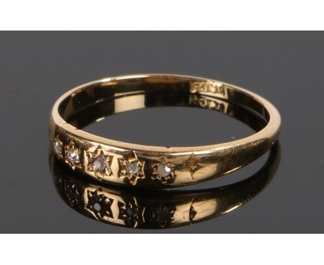 18 carat gold and diamond ring, the five diamonds inset into the shank, ring size M 1/2
