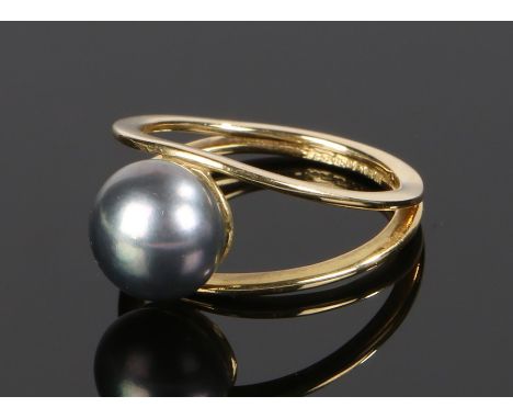 18 carat gold and pearl set ring, with a pearl to the head and arched shoulders, ring size M