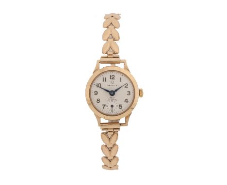 Verity 9 carat gold ladies wristwatch, with a signed silvered dial, manual wound with 9 carat gold strap, the case 21mm diame