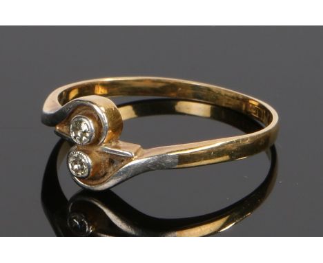 18 carat gold diamond set ring, with two diamonds to the platinum cross over head, ring size N