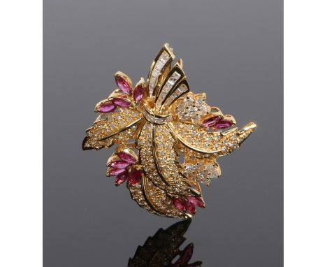 18 carat gold ruby and diamond set brooch, with an arch of leaves tied with a diamond collar, rubies projecting from the edge