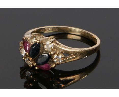 9 carat gold ring, set with sapphires, rubies and cubic zirconia, ring size K From the estate of the Late Alan SearleAlan was