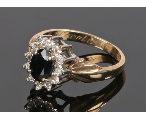 9 carat gold sapphire set ring, with an oval sapphire and flared shoulders, ring size M